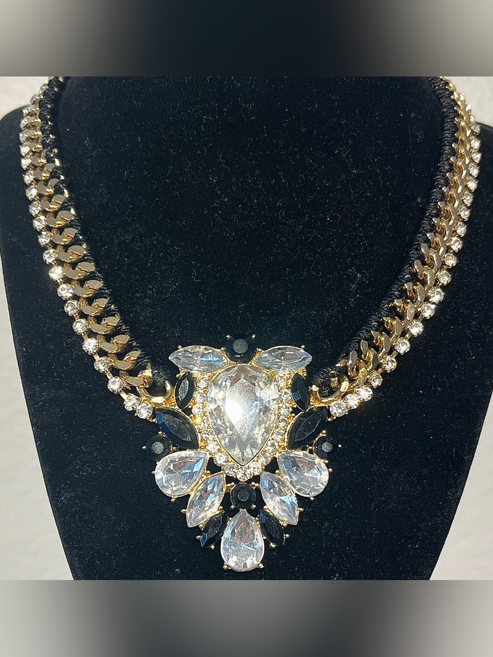Aldo Gold Tone Braided Chain Necklace with Clear and Black Gemstone Pendant